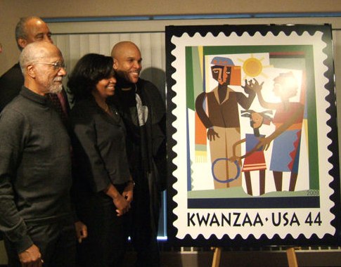 Lloyd McNeil (left) and his Kwanzaa stamp